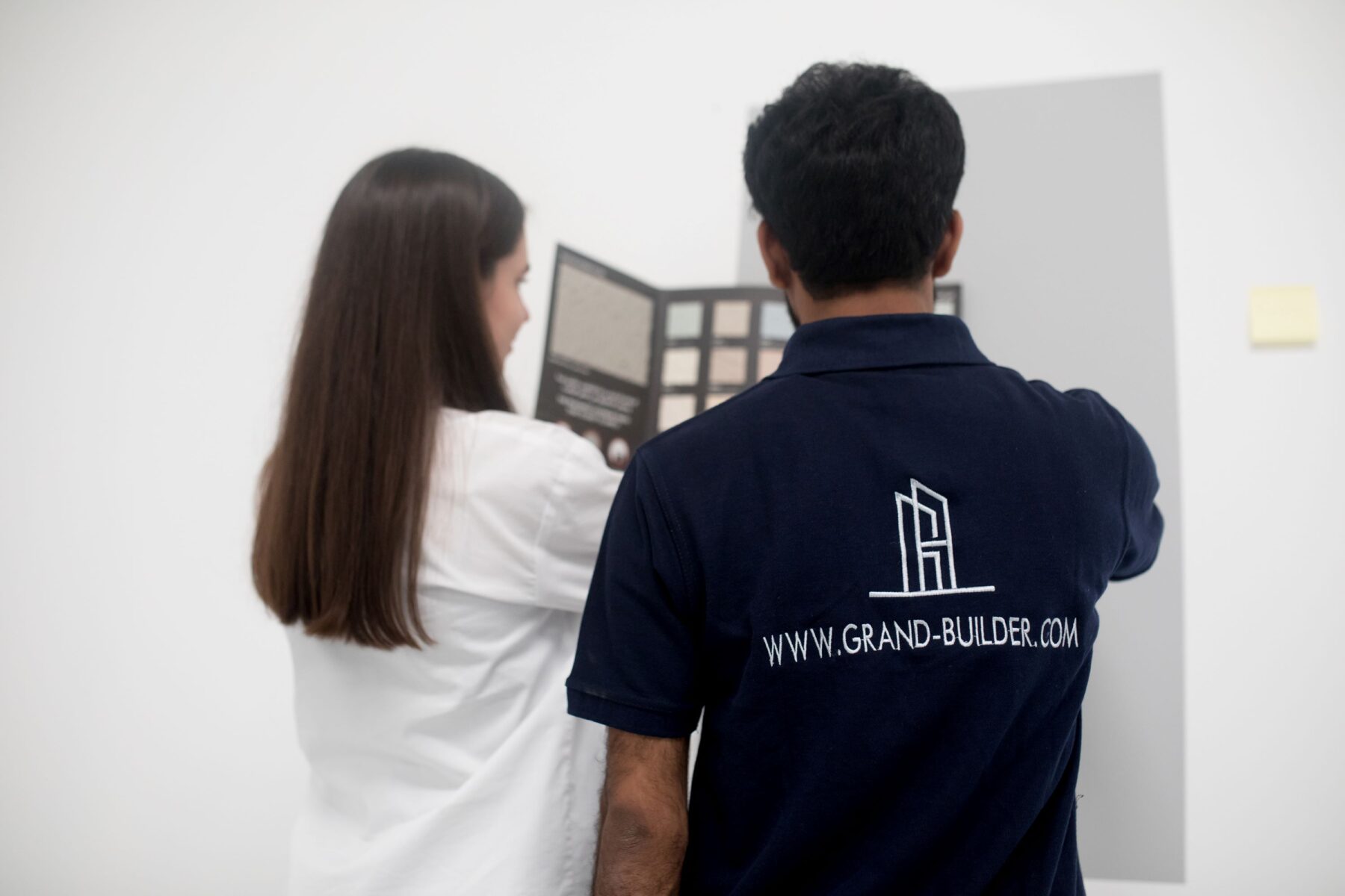 Interior paint and wall finishing works in a Dubai home by Grand Builder